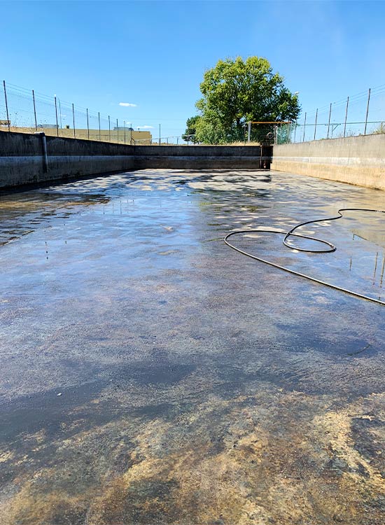 nettoyage boues hydrocarburées, bassin rétention eaux industriel par ovalis